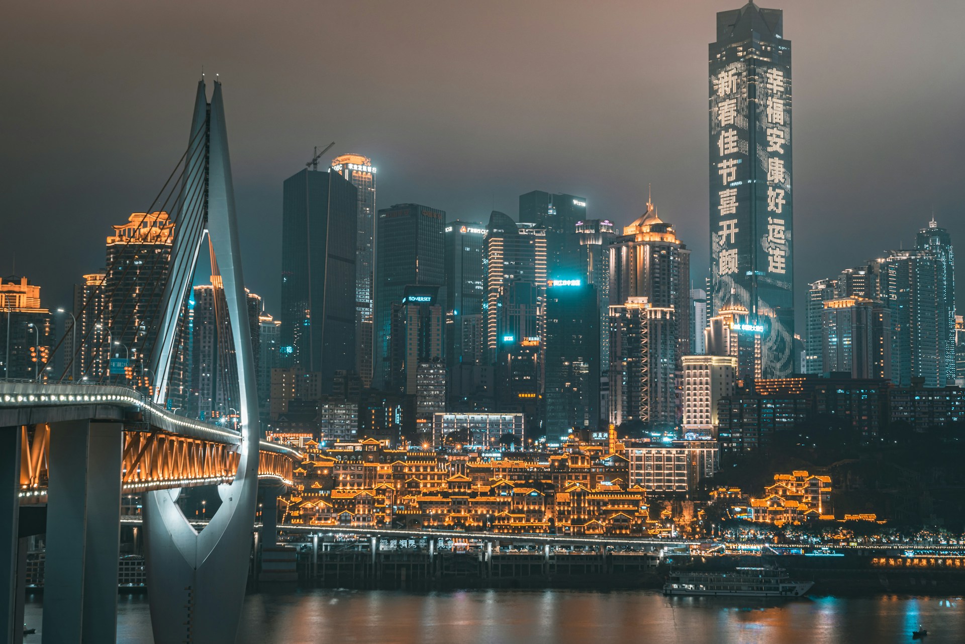 A Chongqing Rail Transit Line 2 train passing through the residential building at Liziba Station — the world's first through-building monorail station